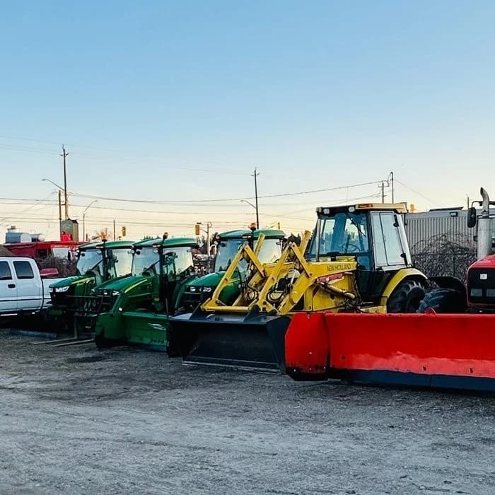 AUI team member operating snow removal equipment in winter conditions