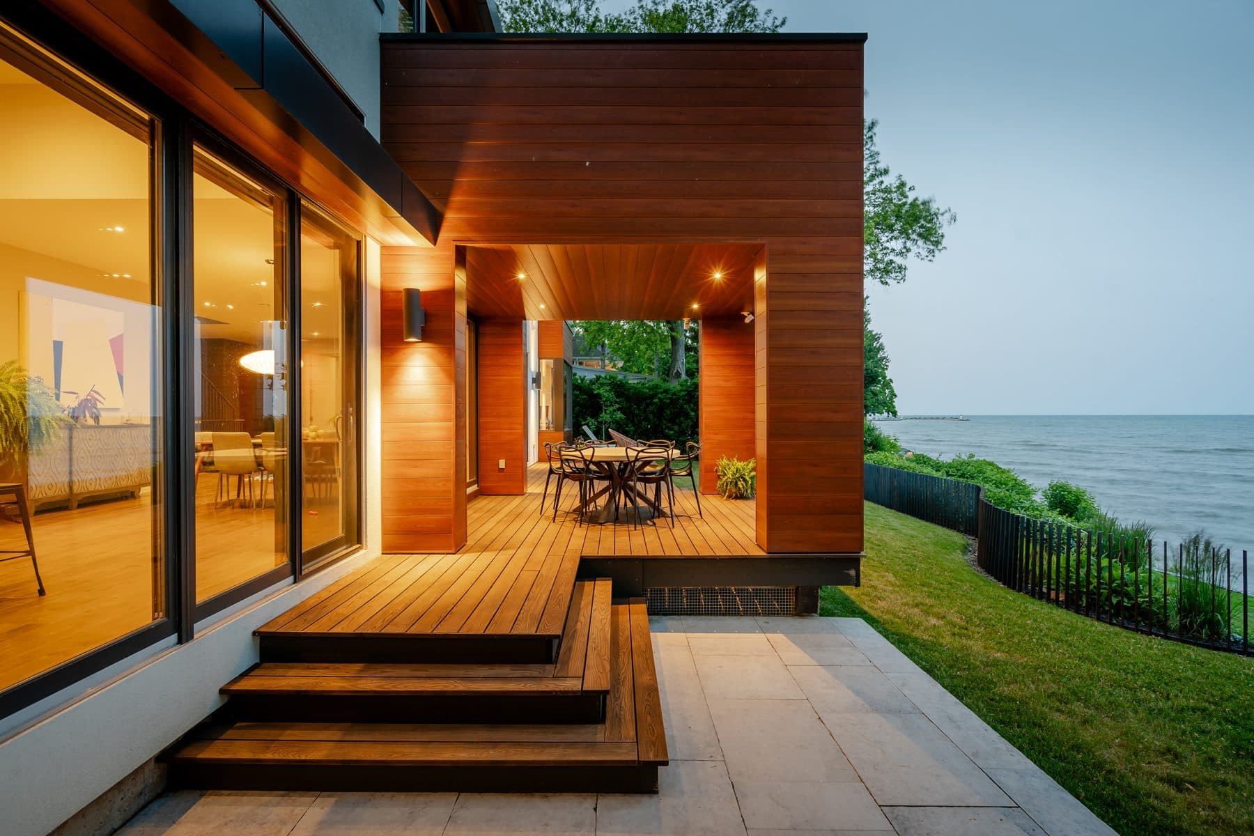 Lakeside luxury landscape with gardens and outdoor living by Golden Mean Landscapes