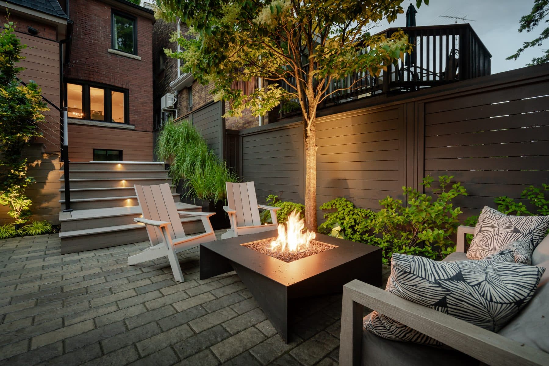 Entertainment-ready backyard oasis with lawn and patio